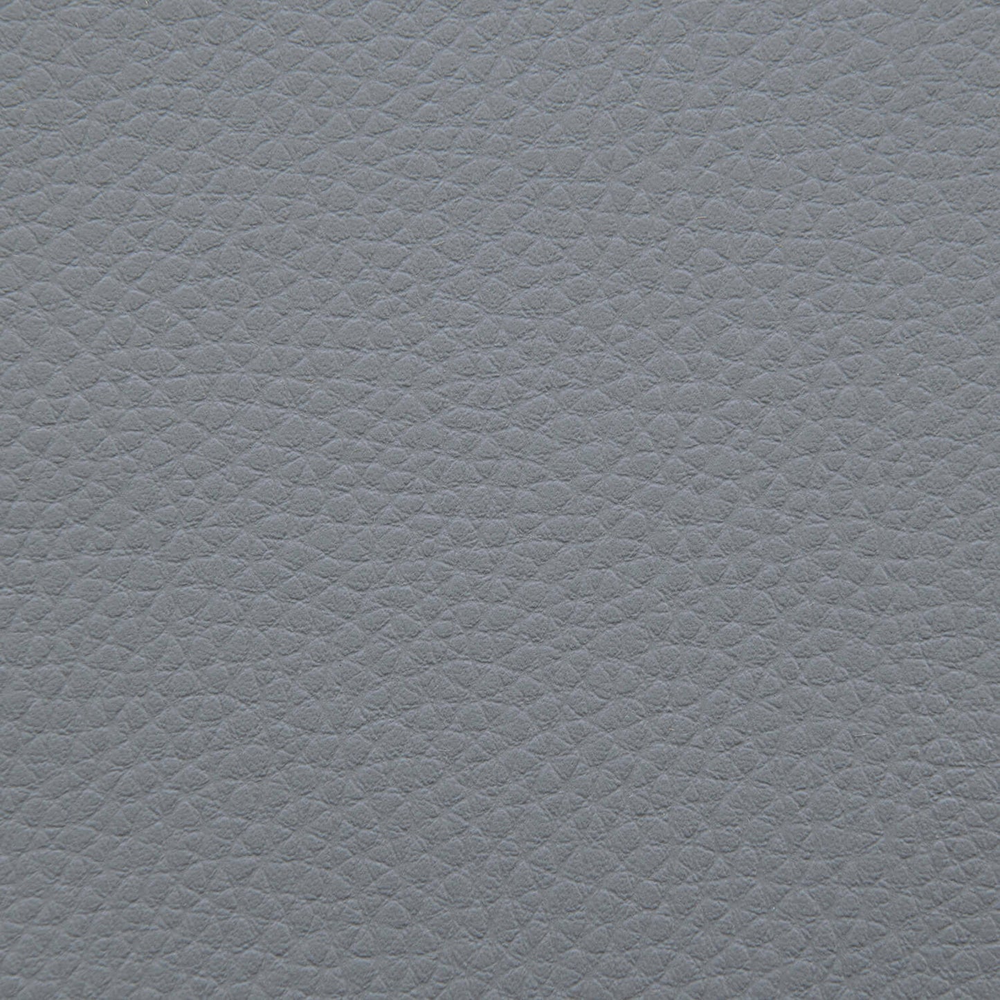 Detalle del cuero gris texturizado del Bean Bag Sunbed Outside - uso exteriores, con un patrón consistente de pequeñas protuberancias similares a guijarros, ideal para relajarse al aire libre.