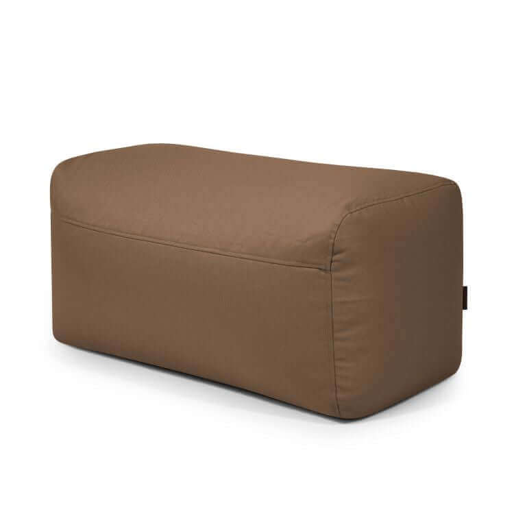 Un puf rectangular compacto y ligero PLUS 100 PROFUSE (100×60×45 cm) con tejido ignífugo, diseño moderno para dormitorio o salón, mostrado sobre fondo blanco.