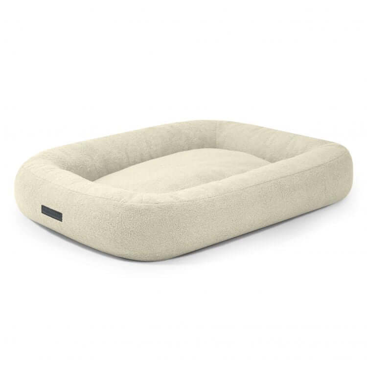 Cama para perro de borreguito rectangular de color crema 100×70×20 cm - DOG BED 100 TEDDY con bordes en relieve y centro plano en suave tejido Teddy, sobre fondo blanco liso.