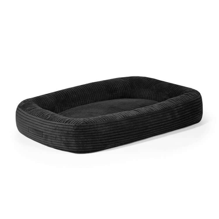 Cama rectangular para perro de terciopelo acanalado DOG BED 75 WAVES (75×60×18 cm) con bordes elevados y superficie plana, fotografiada sobre fondo blanco.