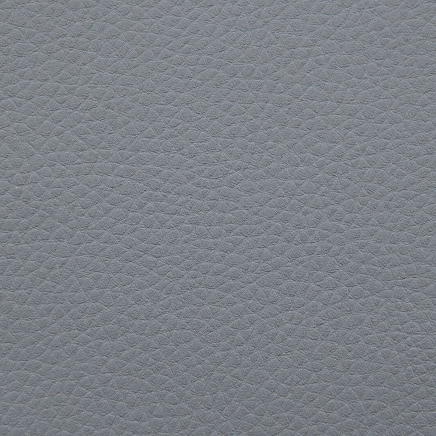 Detalle de la piel gris texturizada con grano de guijarro sutil, perfecto para el Bean bag Lounge Outside - uso exteriores para mejorar su experiencia de asientos al aire libre.