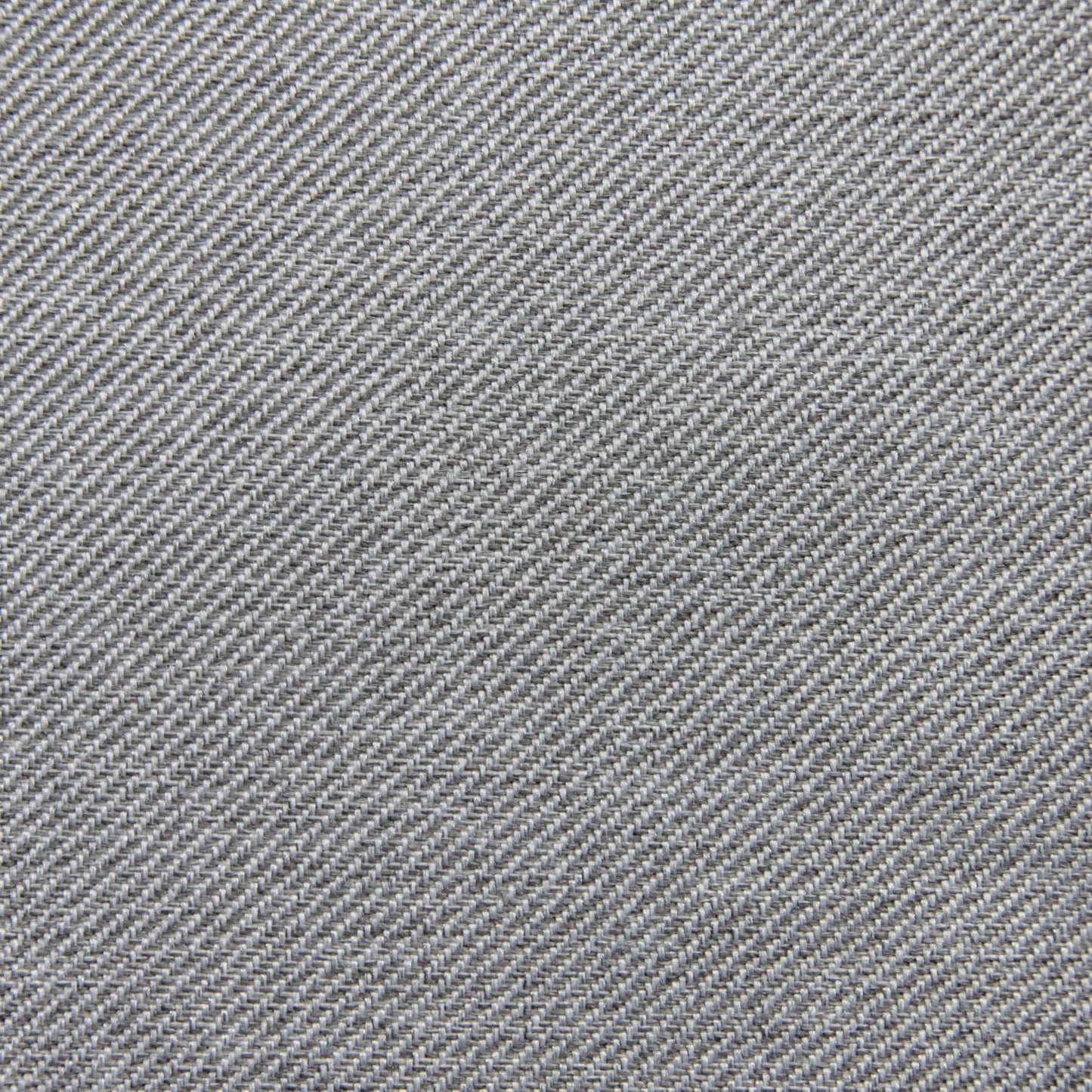 Primer plano de tejido vaquero azul con trama diagonal y superficie texturizada, parecido a la duradera tapicería del Bean bag Lounge Riviera - uso exteriores relleno de perlas de poliestireno.