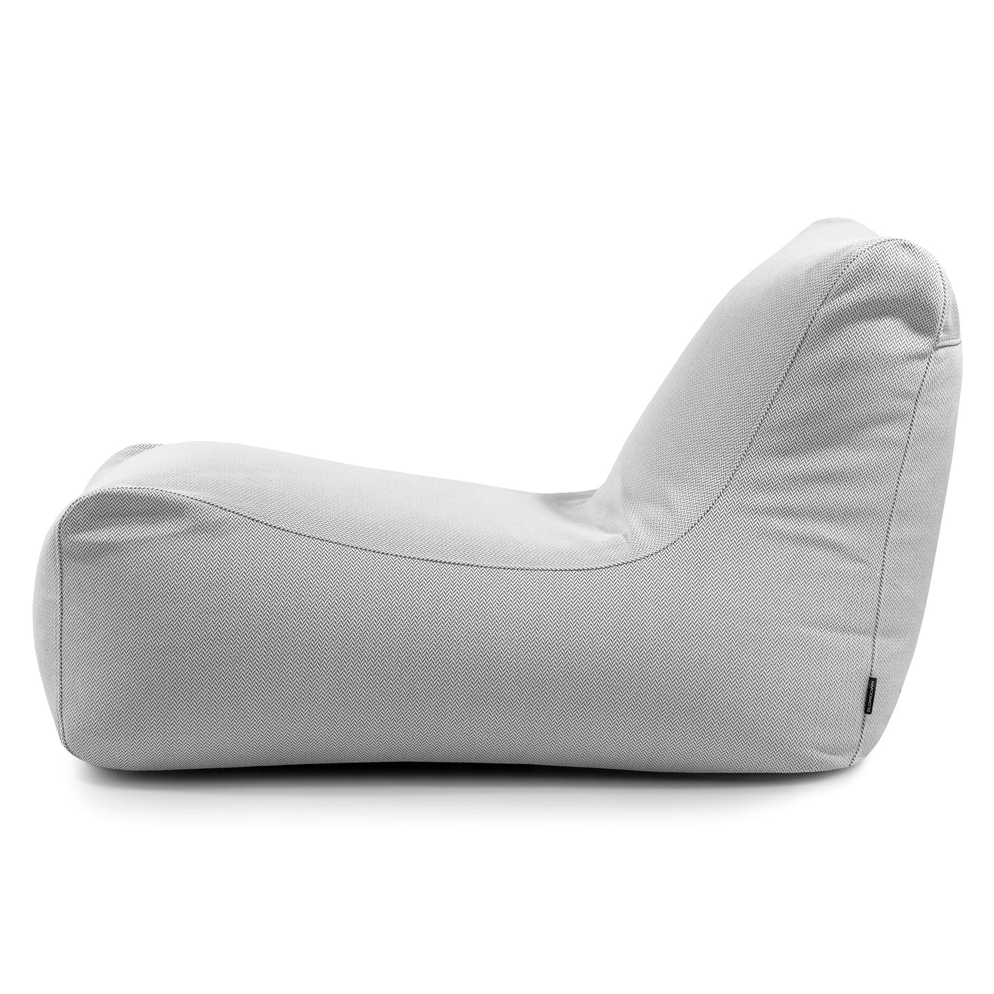 Bean bag Lounge Canaria - uso exterior de color gris claro, con perfil bajo y contorneado y asiento ergonómico, mostrado de perfil sobre fondo blanco.