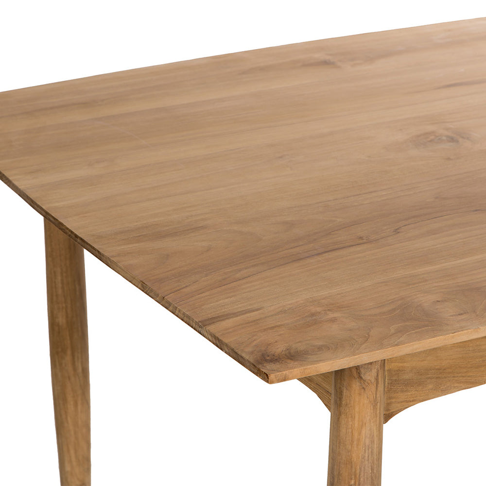 La Mesa de comedor rectangular en madera de teca Berlín presenta una mesa de madera con un acabado suave y natural y esquinas redondeadas sobre un fondo blanco, capturando un diseño moderno a través de su elegante simplicidad.