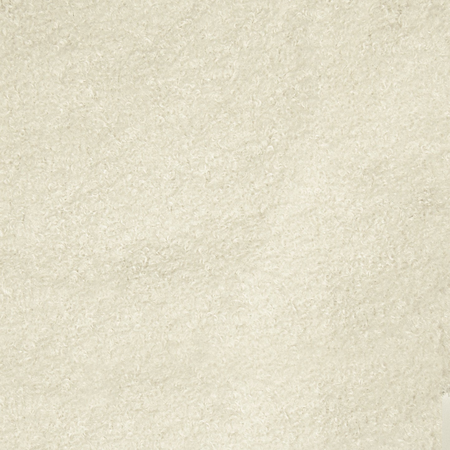 Detalle del tejido borreguito beige texturizado del Puff Puff RAZZMATAZZ TEDDY (155×120×95 cm), ideal para un salón o dormitorio moderno, destacando sus suaves bucles y su aspecto acogedor.