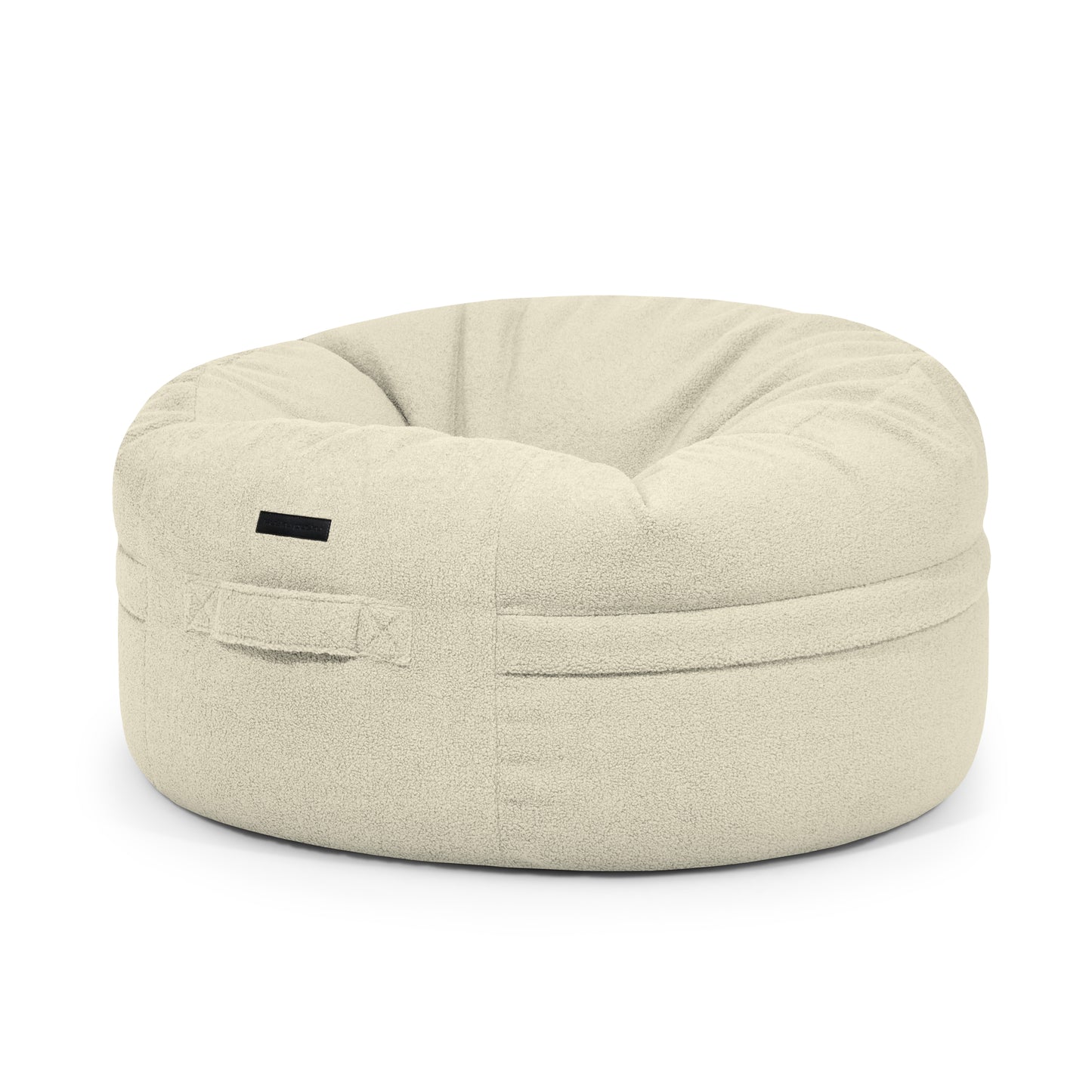 A puff grande redondo ROLL 105 TEDDY de tejido borreguito beige (105×105×50 cm) para interior, moderno, con asa lateral y asiento ligeramente hundido para mayor comodidad.