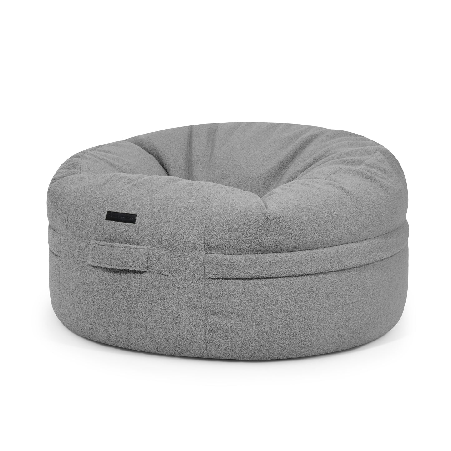 El Puff grande redondo de tejido borreguito ROLL 105 TEDDY (105×105×50 cm) es moderno y para interior, ofrece asiento cómodo y suave, e incluye un asa frontal para moverlo fácilmente.