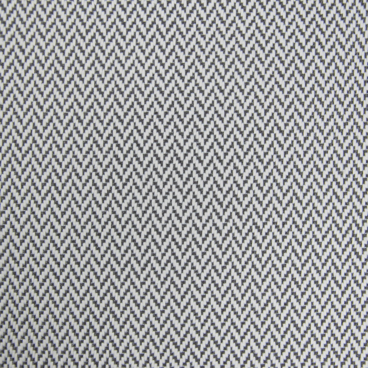 Detalle de un dibujo de espiga en zigzag blanco y negro en el Bean Bag Roll 135 Canaria - uso exteriores, ideal como puff ergonómico o asiento para exteriores.