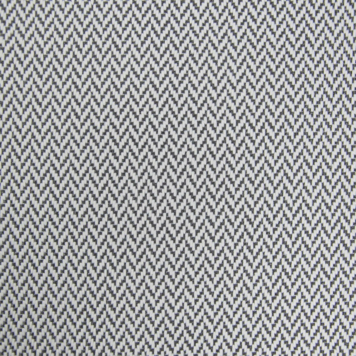 Detalle del tejido en espiga blanco y negro con textura en zigzag, ideal para acentuar un moderno Bean bag Tube 100 Daybed Canaria para espacios de descanso al aire libre.