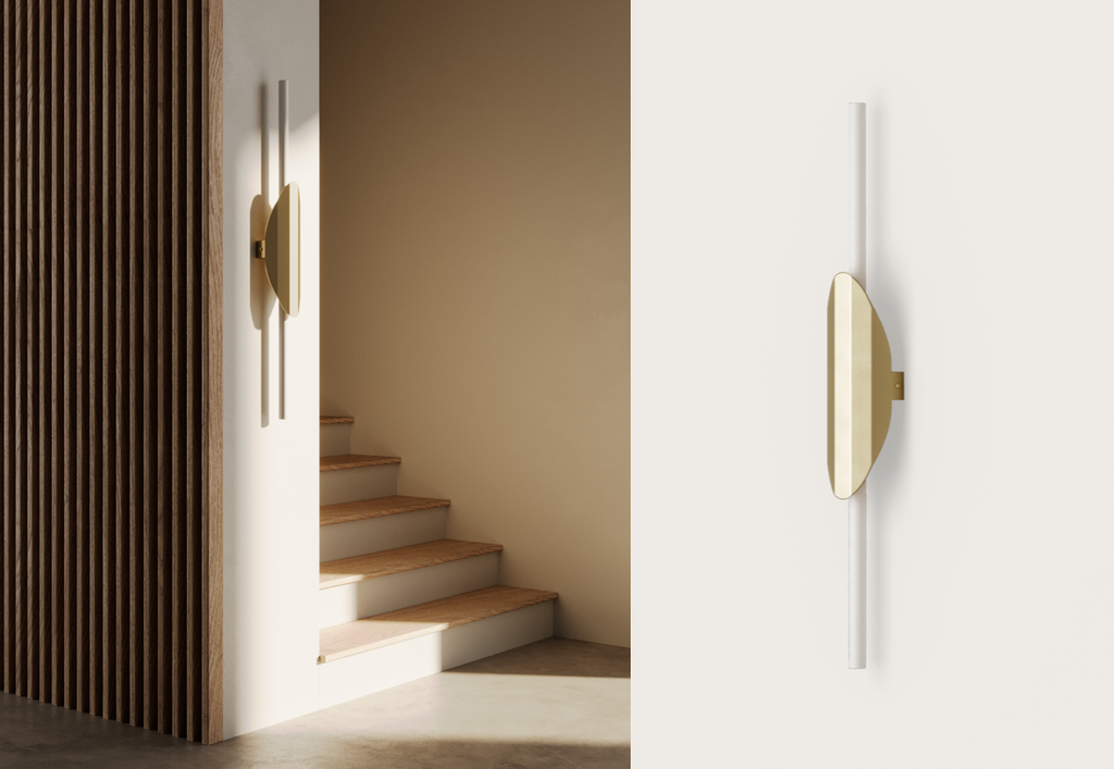 El aplique de pared Pared LED Xago, con diseño moderno e iluminación LED, está montado en una pared blanca junto a unas escaleras de madera en un interior minimalista.