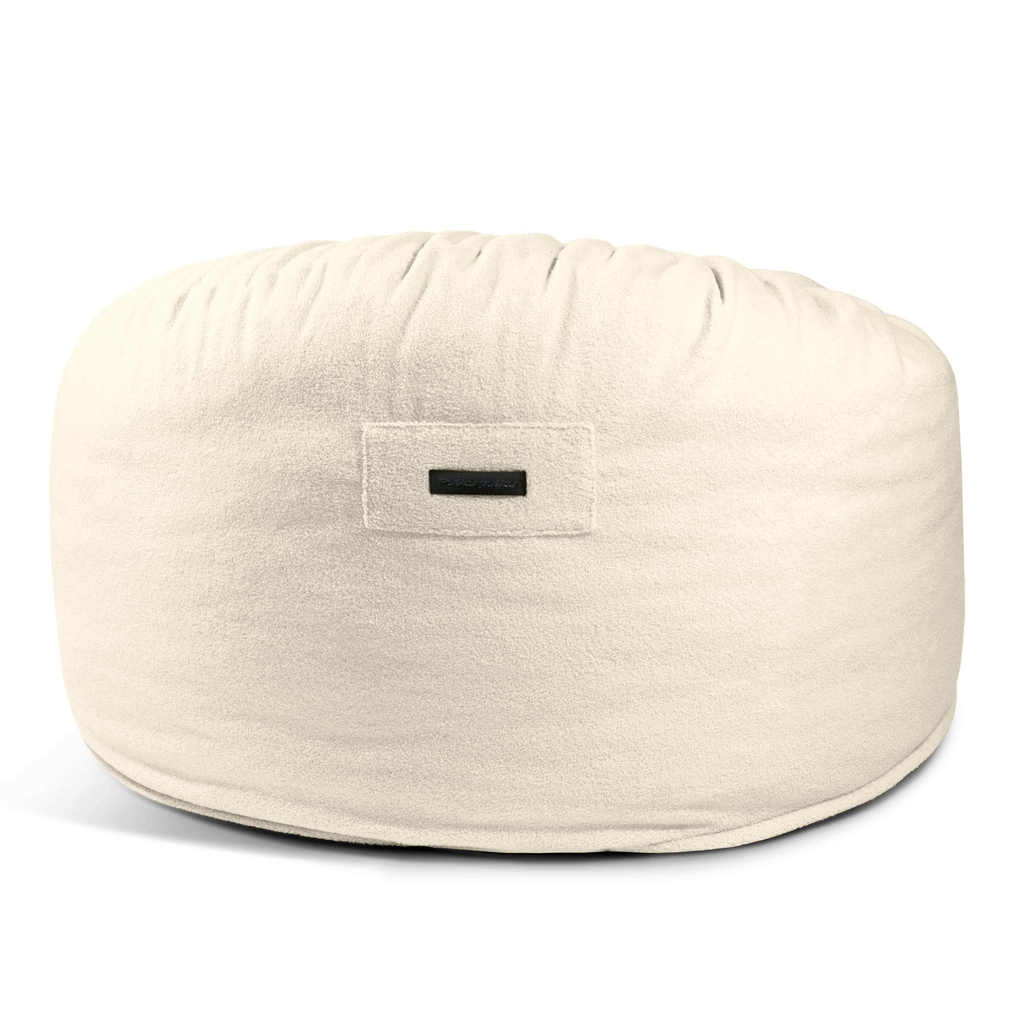 El Foam Bean Bag OM 110 Barcelona es un gran sillón redondo tipo puf donut con un suave acabado en blanco roto y una pequeña etiqueta rectangular en la parte delantera.
