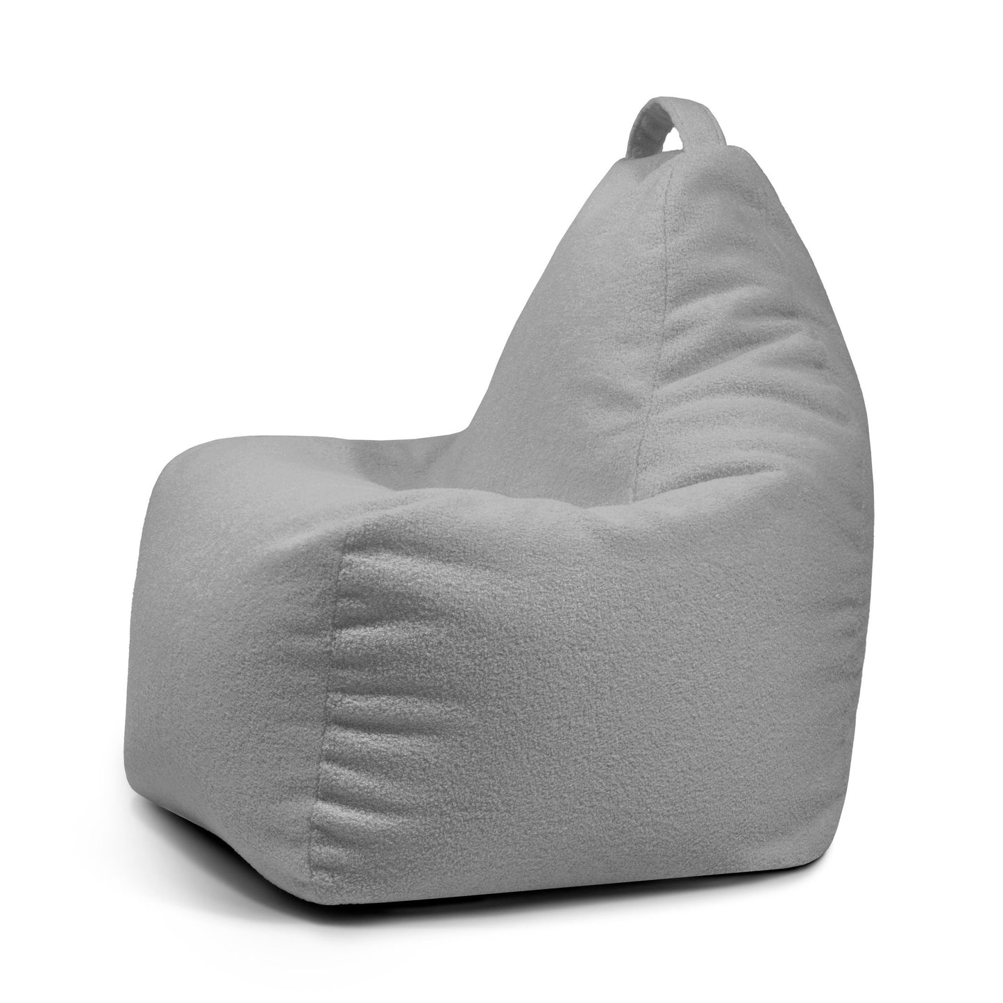 El Bean bag Play Teddy en tejido gris claro presenta un respaldo alto y un asa superior, mostrado de lado sobre un fondo blanco; este puff infantil mezcla comodidad con un estilo de diseño moderno.