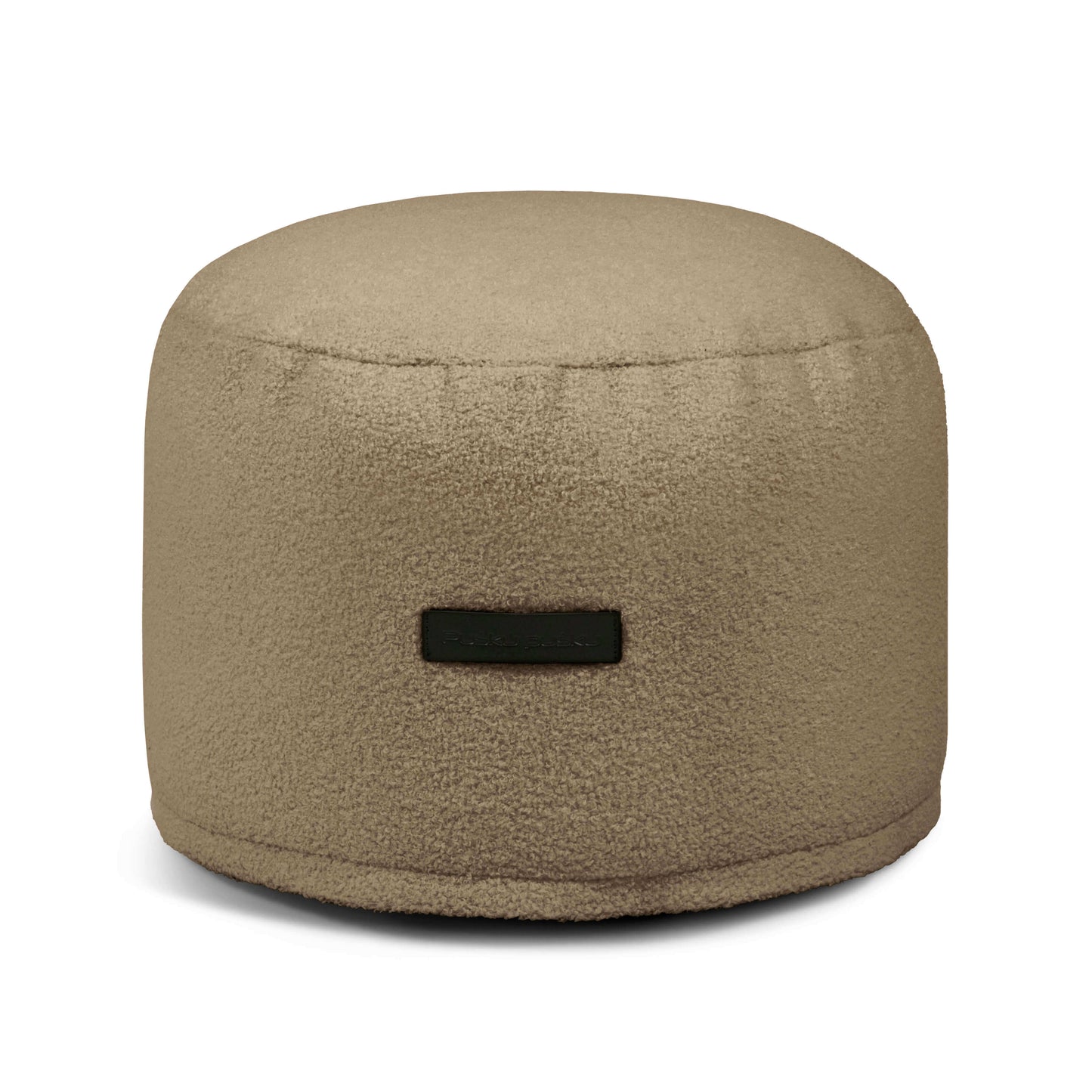 Puff redondo de borreguito MINI TEDDY 40×40×30 cm en color taupe, con tela texturizada y pequeña etiqueta frontal; ideal como puf compacto o asiento ergonómico para dormitorio o salón.
