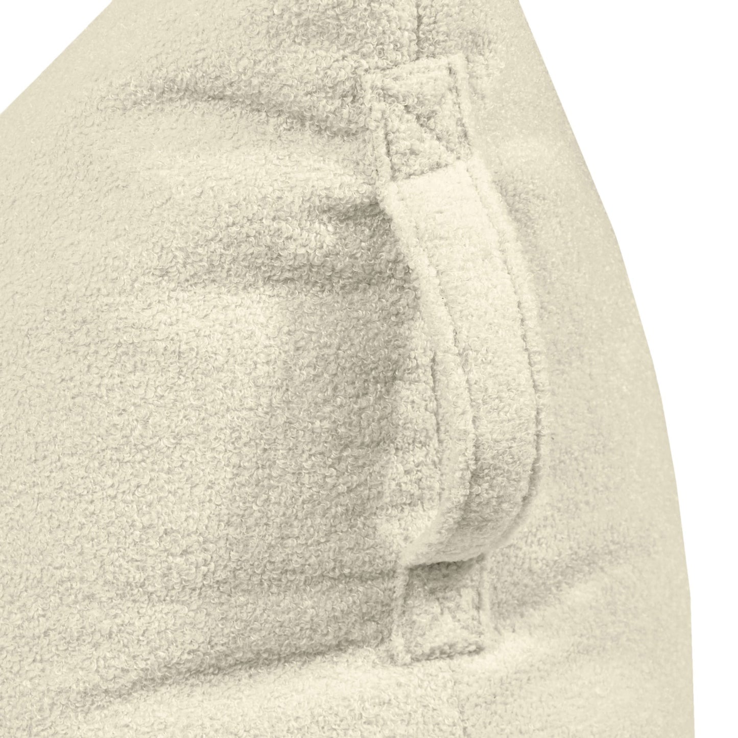 Detalle del Bean bag puff infantil de tela borreguito 75×110×65 cm de RAZZY TEDDY, mostrando el asa cosida y el detalle de la costura en tela beige claro sobre fondo blanco.