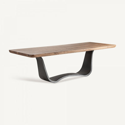 Una mesa de comedor con base negra y patas negras.