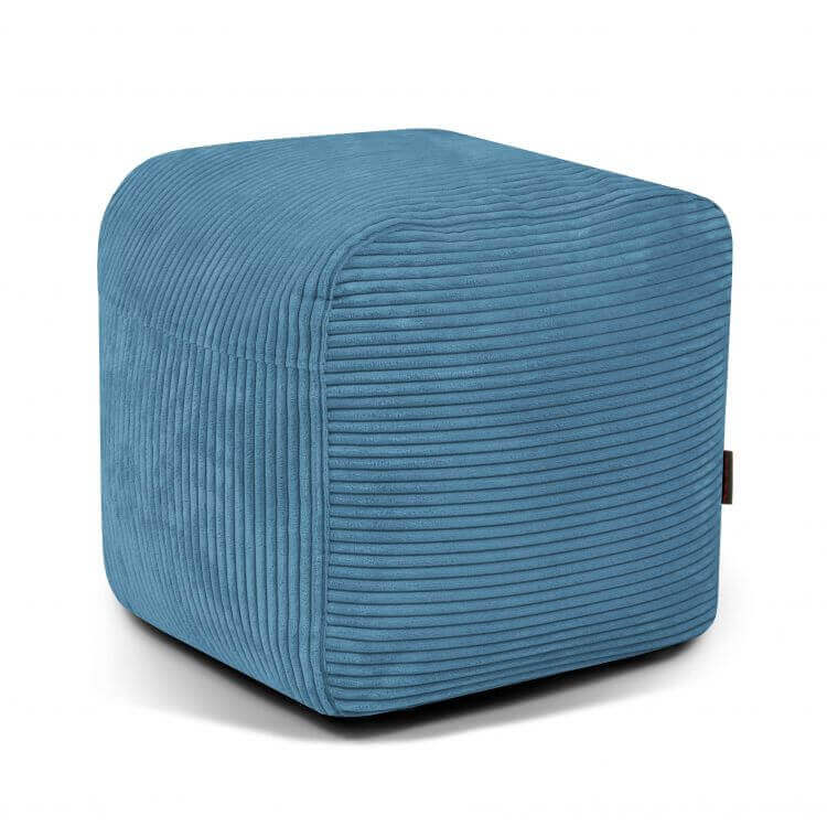 Un puf compacto y ligero de pana azul (50×50×35 cm) con un diseño moderno, ideal para dormitorios o cuartos de juegos-PLUS 50 WAVES-mostrado sobre fondo blanco.