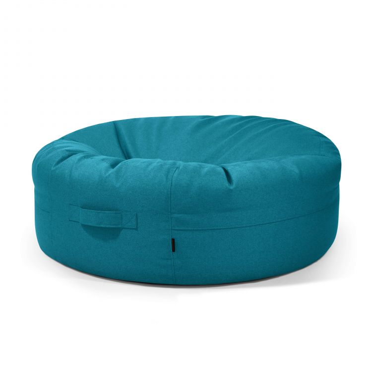 El Puff gigante redondo de tela lavable 135×135×50 cm, modelo ROLL 135 NORDIC moderno para salón, cuenta con asa lateral y ofrece un asiento ergonómico para máxima comodidad en cualquier espacio.