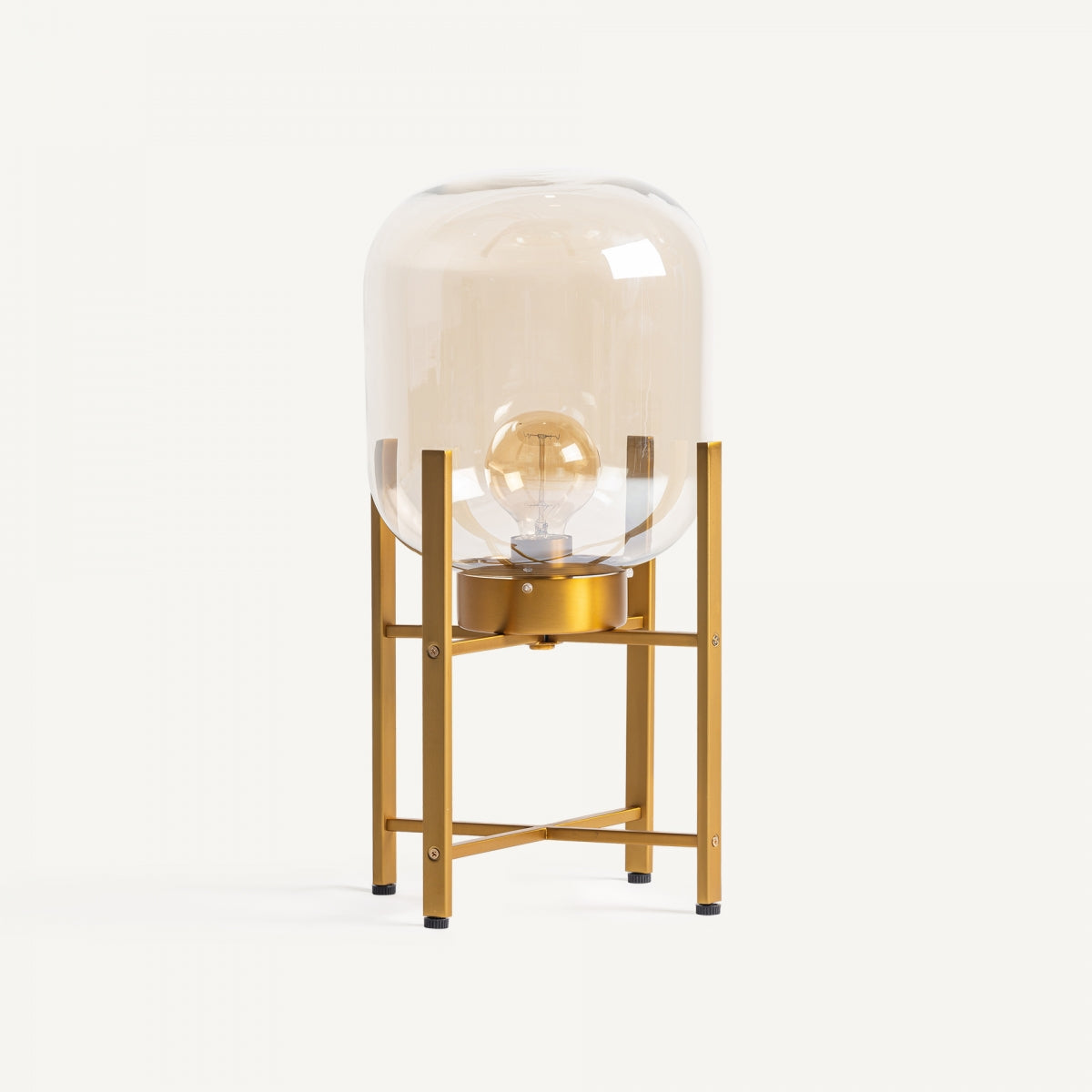 La Lámpara de mesa en latón y cristal Aurea tiene una cúpula de cristal transparente y base dorada, con bombilla expuesta: ideal para decoración interior moderna.
