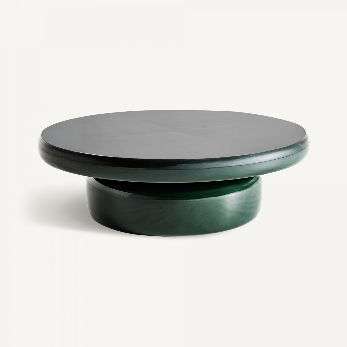 La Mesa de centro redonda de fibra Gory es una elegante y moderna mesa de centro redonda con una superficie verde vibrante y una base cilíndrica de madera DM. Su diseño minimalista complementa cualquier espacio contemporáneo.