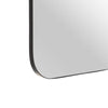 Un primer plano del Espejo metal cristal moderno Elegante revela su diseño rectangular negro con bordes redondeados y un marco delgado, agregando un toque de estilo moderno contra el fondo blanco.
