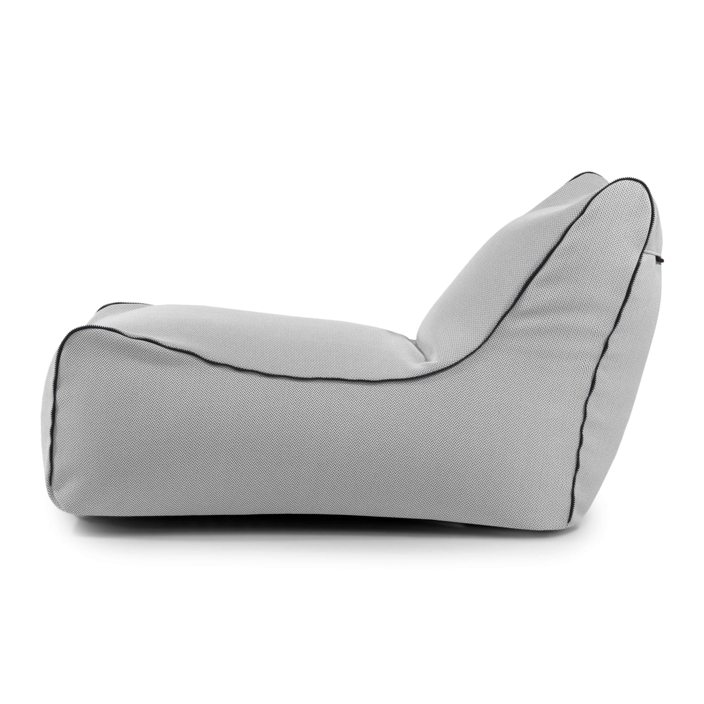 El Bean bag Lounge Zip Canaria - uso exteriores es un sillón modular gris claro con ribete negro, mostrado de lado sobre fondo blanco, que proporciona un asiento ergonómico y elegante para cualquier espacio lounge.