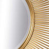 Espejo Oro Metal Solario con un diseño inspirado en los rayos del sol y marco dorado.