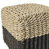 Primer plano del Puff de seagrass negro y natural Black/Nat 33x46, que presenta una parte superior beige texturizada con una base más oscura, resaltando su diseño moderno y calidad artesanal.
