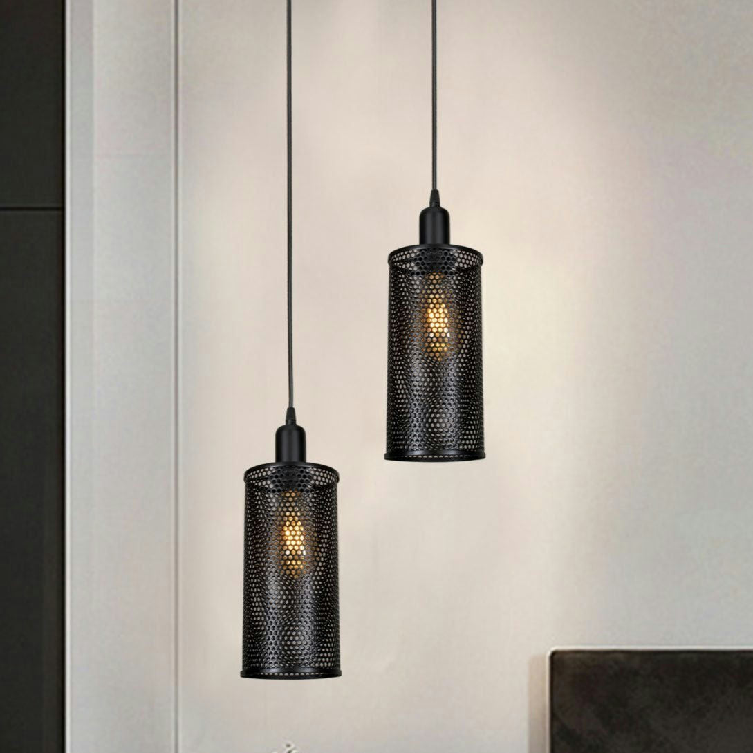 Dos Lámpara de Techo Colgante Industrial Contemporáneo 3003-1C cilíndricas cuelgan del techo, iluminadas contra una pared neutra, mostrando un elegante diseño industrial.