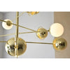 Descripción: Una lámpara de techo LED G9 15x3.5W - Bico dorada con esferas colgantes de ella.