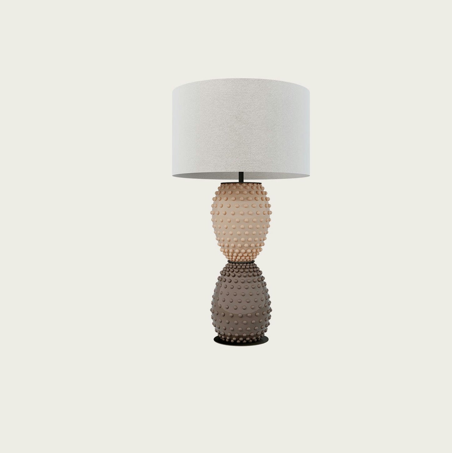 La lámpara de mesa Cactus NAC135/2 presenta una base texturizada de dos tonos que se asemeja a un cactus y está rematada con una gran pantalla redonda blanca, que rezuma diseño moderno.