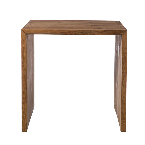 La Mesita de noche en madera de teca Recta 50 es una mesa de madera con tablero rectangular y patas rectas, que muestra un acabado en madera de teca natural que realza su diseño moderno.