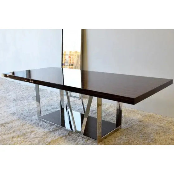 Descripción: Una elegante mesa de comedor Ébano y Acero - Luxus con patas de cromo y un espejo.