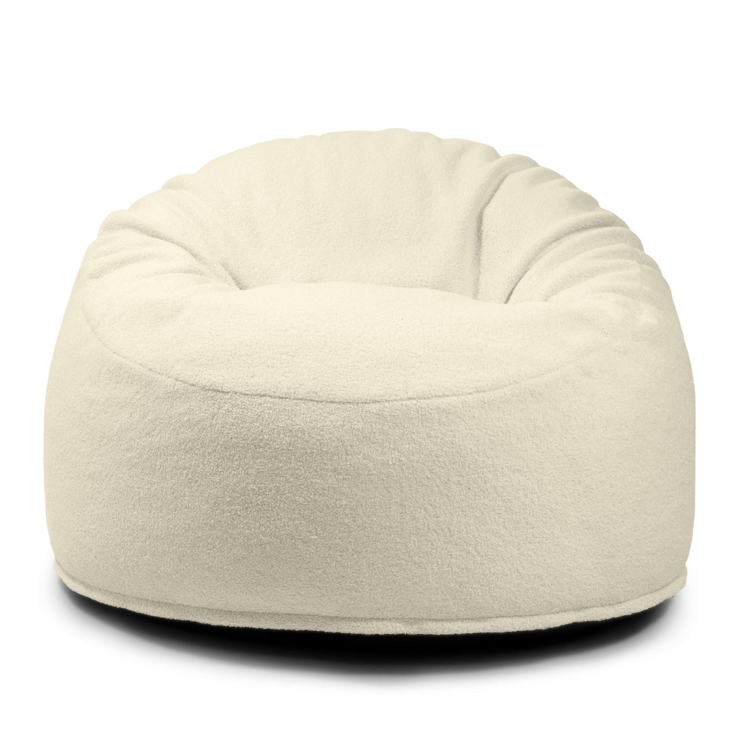 El OM 85 TEDDY es un acogedor puff redondo de espuma y borreguito (85×85×38 cm), ideal para salones o dormitorios. Mostrado sobre fondo blanco, es perfecto para añadir confort a cualquier espacio.