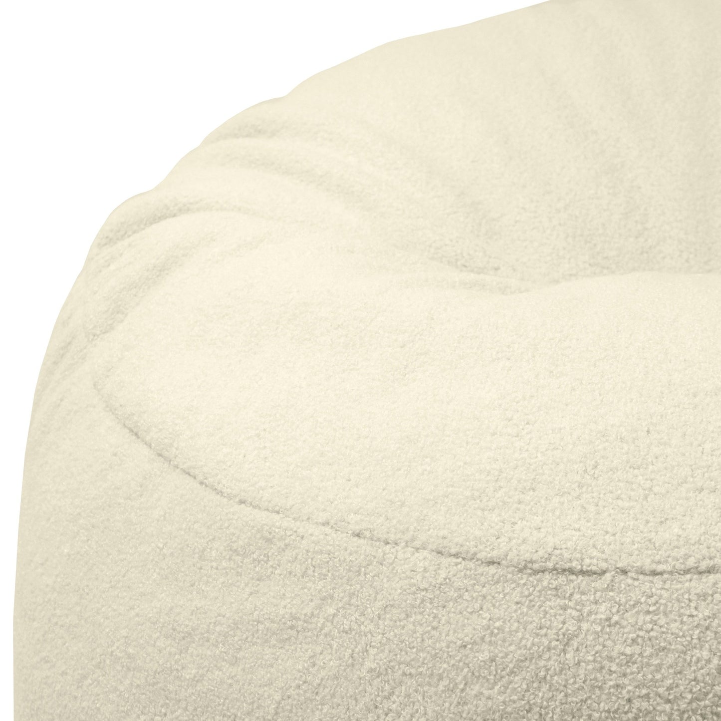 Detalle del OM 85 TEDDY puff redondo de foam y borreguito (85×85×38 cm), que muestra su tejido texturizado de color crema y sus suaves costuras redondeadas, perfecto para añadir un toque acogedor a tu salón o dormitorio.