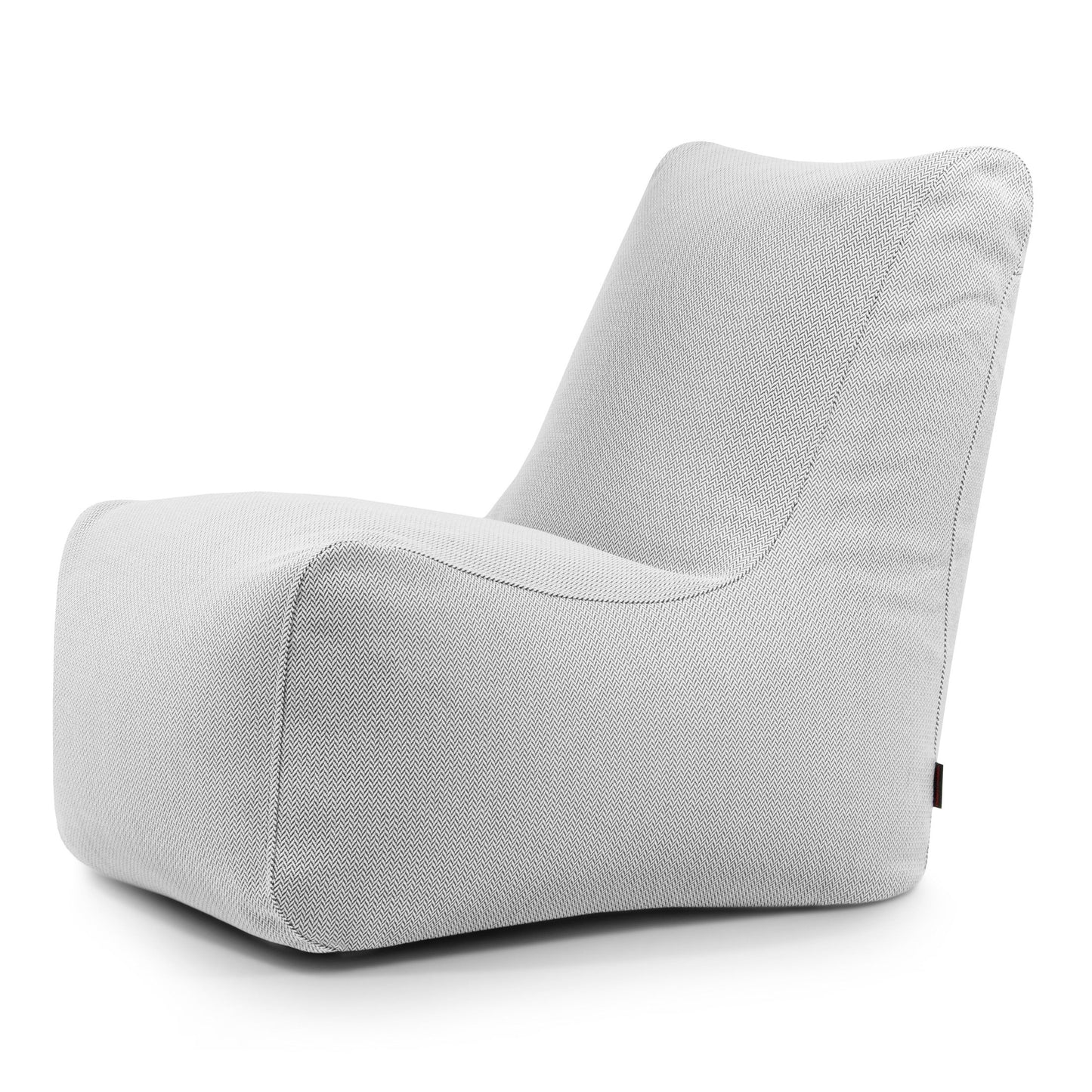 Una moderna tumbona sin brazos, de perfil bajo y bordes curvados, en tejido texturizado gris claro, ideal para uso exterior o combinada con el Bean bag Seat Canaria - uso exterior para un confort versátil.