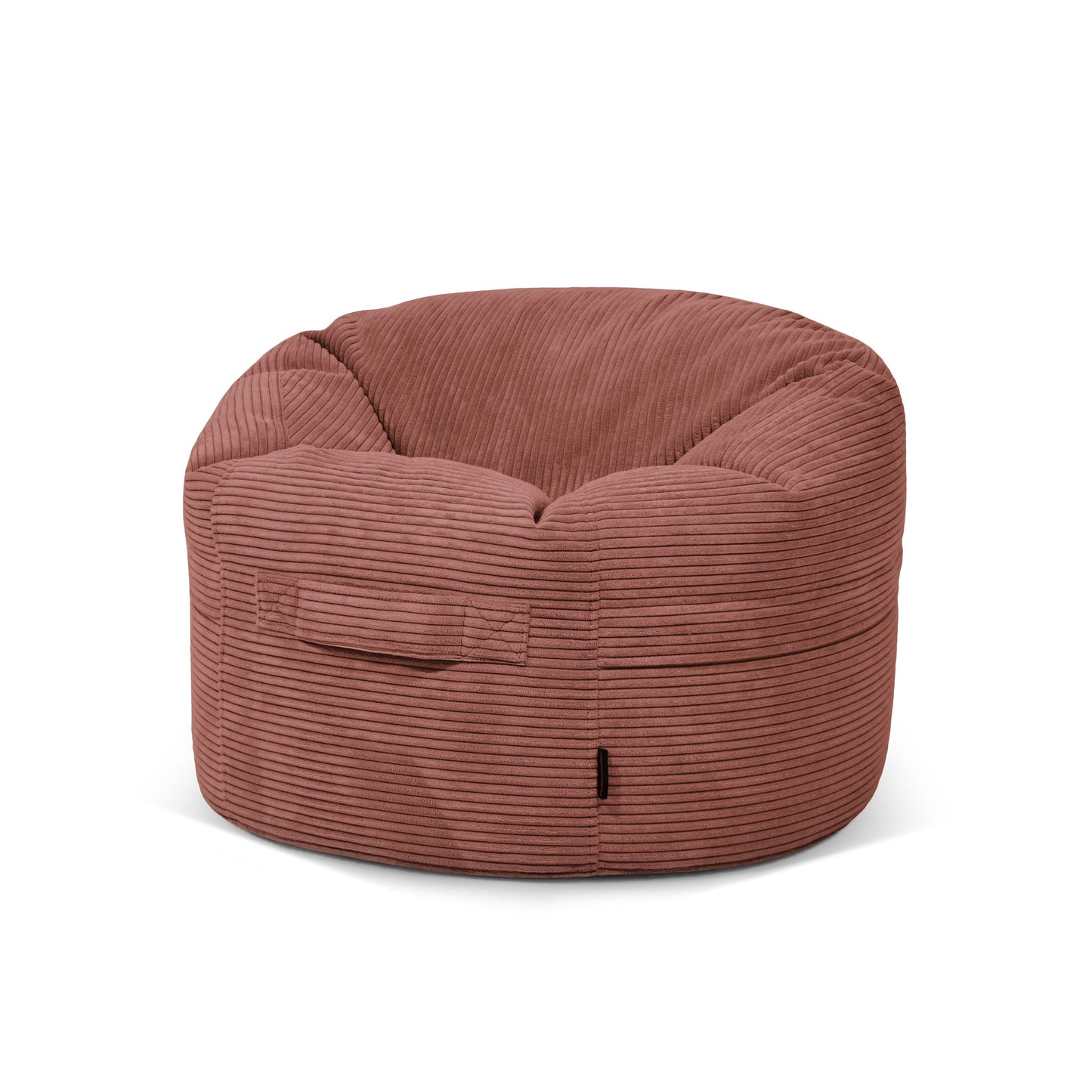 El Puff redondo de terciopelo acanalado ROLL 80 WAVES (80×80×35 cm) en rojo apagado, con asa frontal y bolsillo lateral visible, es perfecto como asiento acogedor para niños en salón o dormitorio moderno.