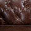 Sillón en Cuero y Madera con Capitone Kensington
