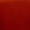 Un Sillón Rojo Nest sobre un tapizado de alta calidad, presentando un diseño moderno con una sutil textura y líneas verticales.