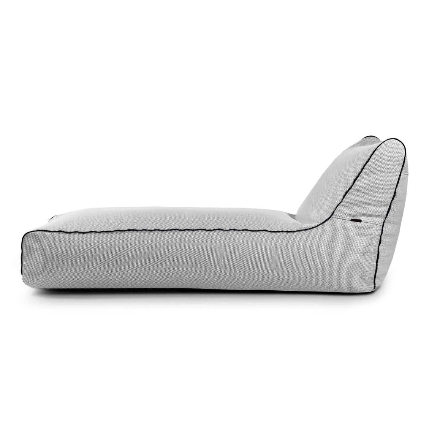 El Bean bag Sunbed Zip Canaria para exteriores se muestra de perfil sobre un fondo blanco, con un moderno diseño gris claro con ribetes negros que recuerda a una tumbona tipo puff.
