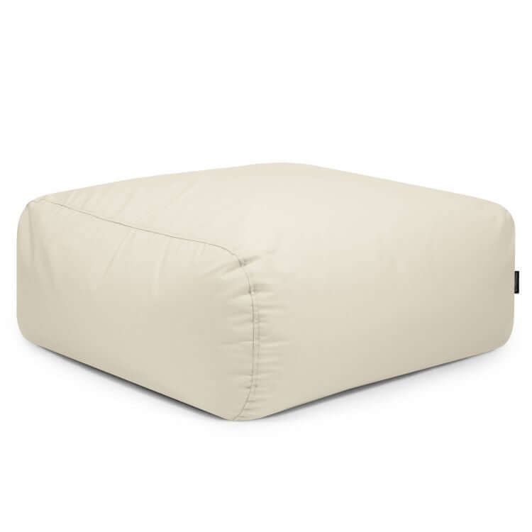 A puf cuadrado TUBE 80 COLORIN de tejido resistente al sol (85×85×38 cm), moderno y apto para interior y exterior, color crema, con superficie lisa y costuras visibles, ideal como puf ergonómico o asiento exterior sobre fondo blanco.