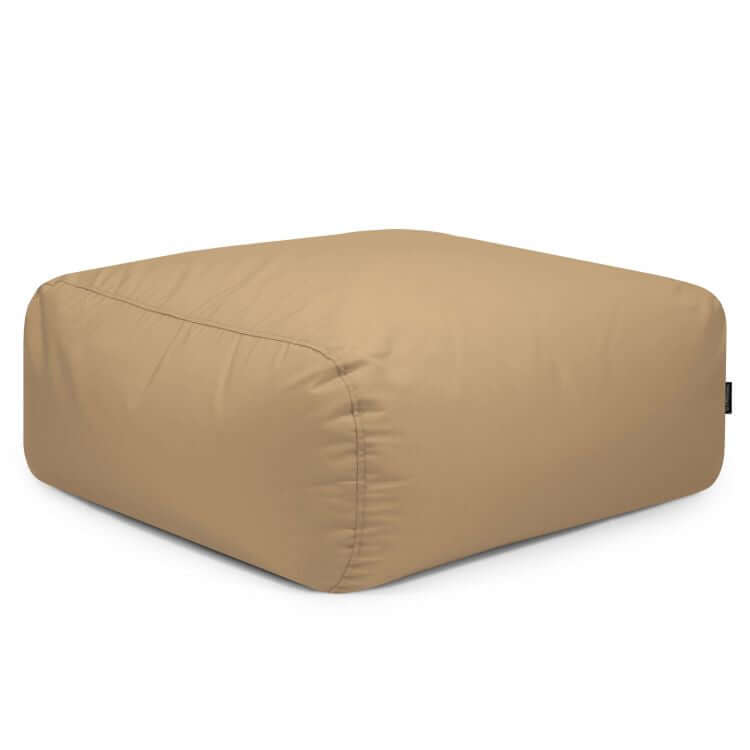 El Puf cuadrado de tejido resistente al sol 85×85×38 cm TUBO 80 COLORIN, moderno y apto para interior y exterior, se muestra en color beige con forma cuadrada y superficie suave sobre un fondo blanco.