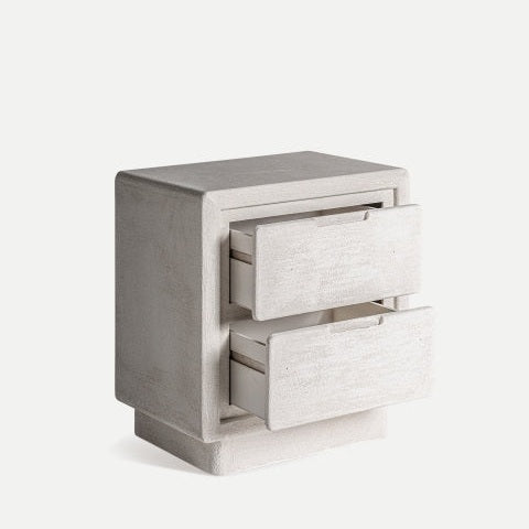 La Mesita de noche en DM blanco Comodino Arnsberg es una mesita de noche compacta de hormigón con dos cajones abiertos, que muestra un diseño minimalista.
