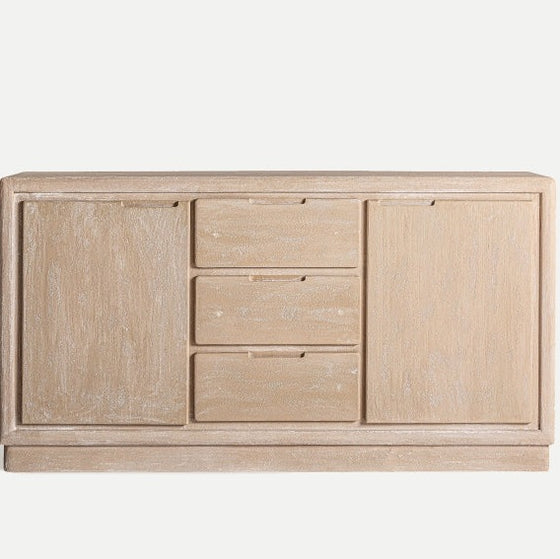 El armario de madera DM Werle presenta un diseño Art Déco con dos puertas en cada extremo y tres cajones centrales, todo en un tono natural claro, que ofrece prácticas soluciones de almacenamiento. Dimensiones: 150 x 38 x 80 cm.