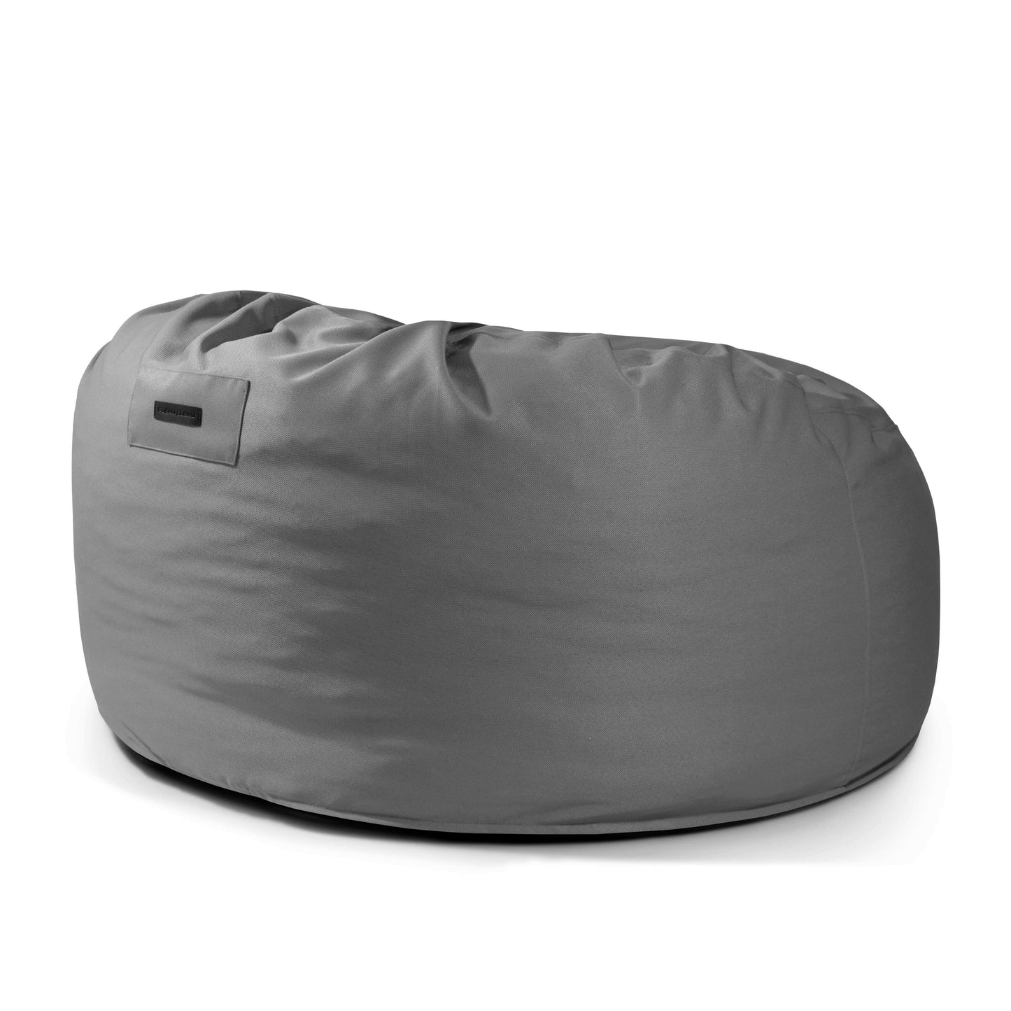 El Foam Bean Bag OM 110 Barcelona es un sillón grande, redondo y gris relleno de copos de espuma de alta densidad y con una superficie de tela lisa, que se muestra sobre un fondo blanco liso.
