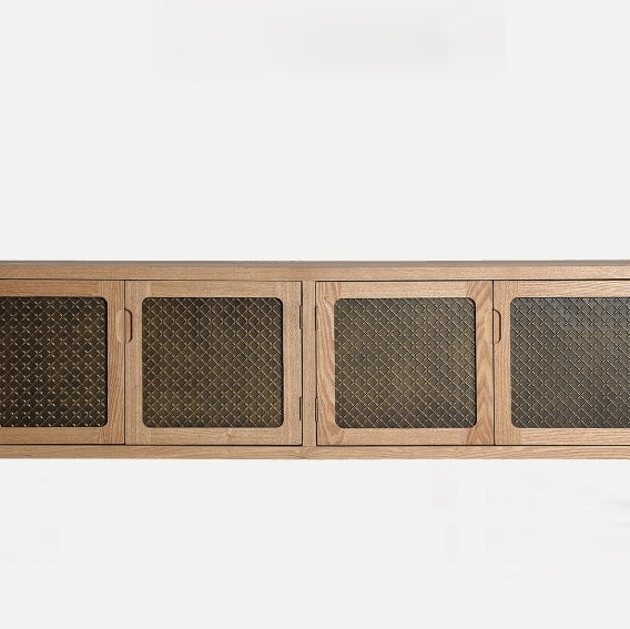 El Mueble TV de madera y aluminio Nevoy es un aparador de madera elaborado con fina madera de pino con cuatro puertas frontales de malla, realzado por un elegante acabado dorado envejecido.