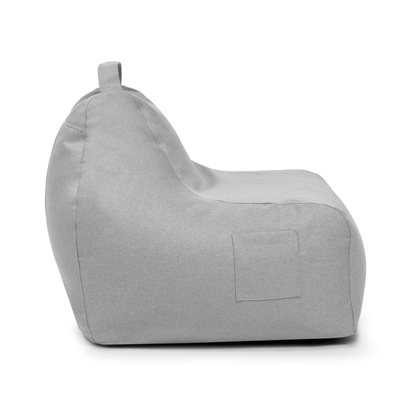 El Bean Bag Game Nordic es un sillón bean bag gris claro de forma cuadrada con respaldo, perfil lateral visible, bolsillo cosido y asa de transporte superior, ideal como asiento infantil para jugar o relajarse.