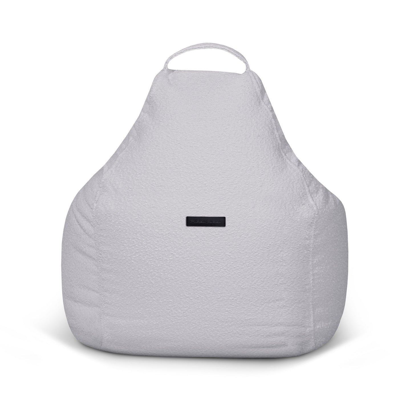 El Bean bag Play Madu es un sillón de felpa de color gris claro con asa superior y etiqueta negra delantera, que ofrece un cómodo asiento. Se muestra sobre un fondo blanco.
