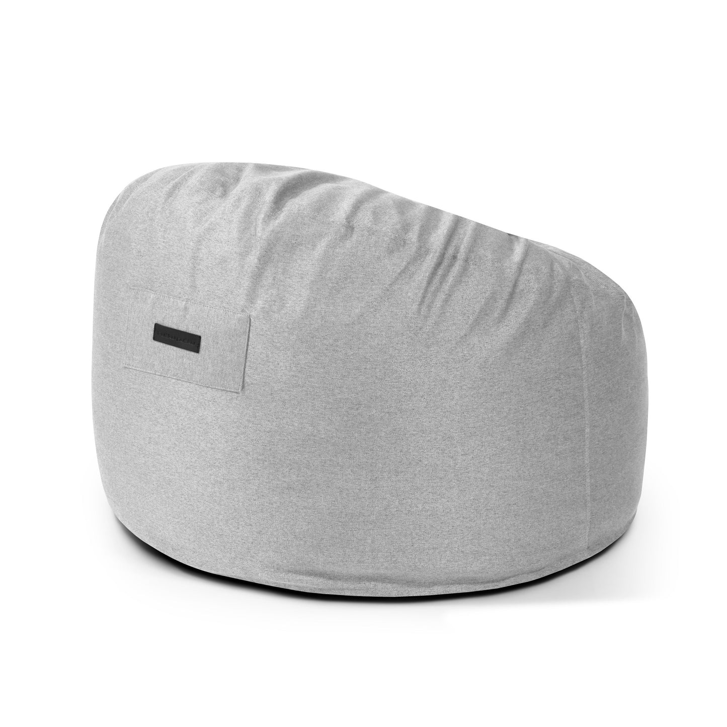 El Puff redondo de foam y tejido nórdico 85×85×38 cm - OM 85 NORDIC es un cómodo puf infantil gris claro, de forma redonda, perfecto para salón o dormitorio con etiqueta rectangular lateral.