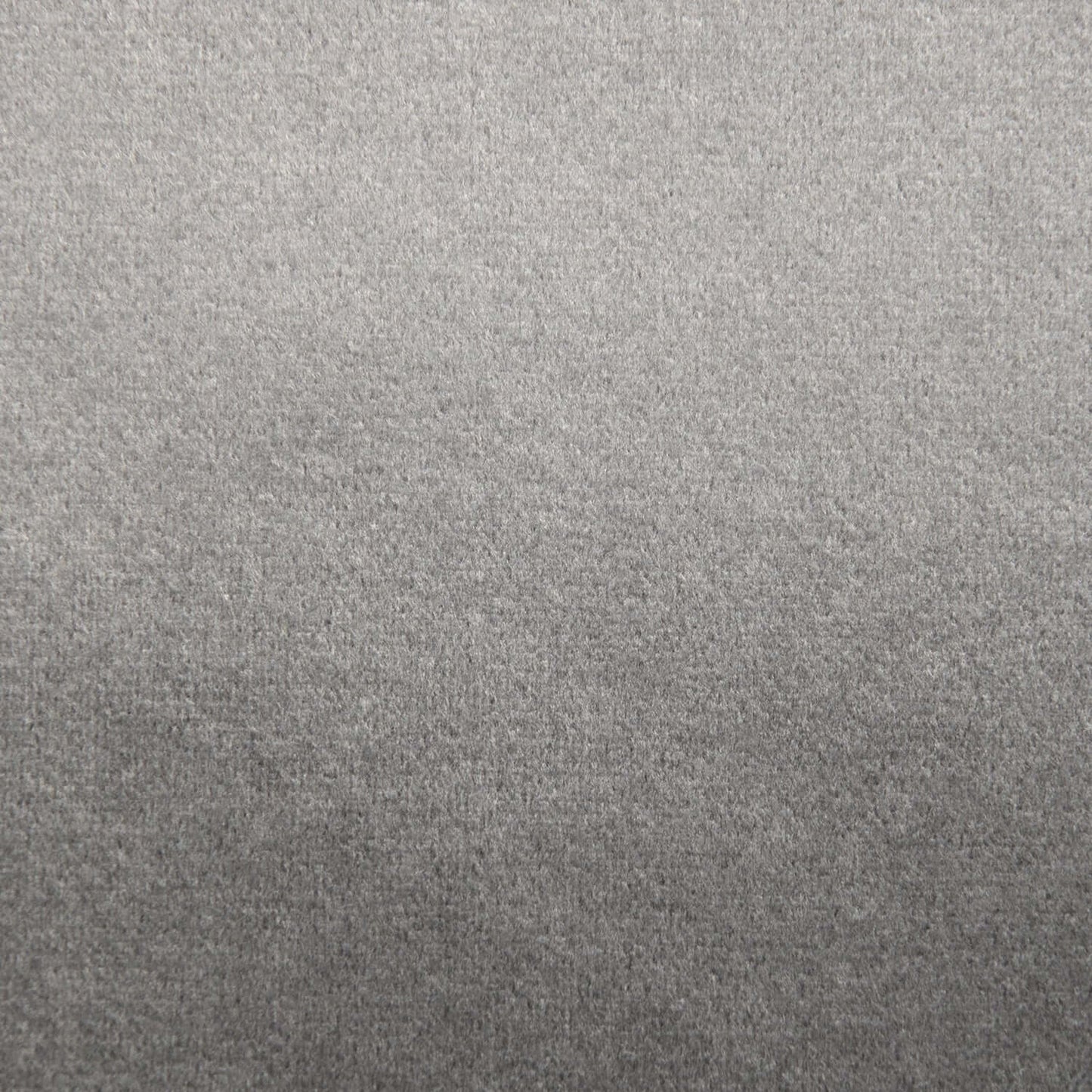 Primer plano de una superficie gris suave y ligeramente texturizada, perfecta para el Puff redondo de foam y terciopelo 110×110×75 cm - moderno - salón - OM 110 BARCELONA, garantizando un asiento cómodo en cualquier espacio.
