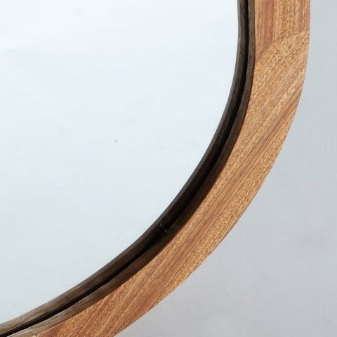 Primer plano del Specchio Busk, un espejo de madera de ébano (100x130 cm), que muestra su marco redondo y superficie reflectante sobre un fondo claro, perfecto para la decoración contemporánea.